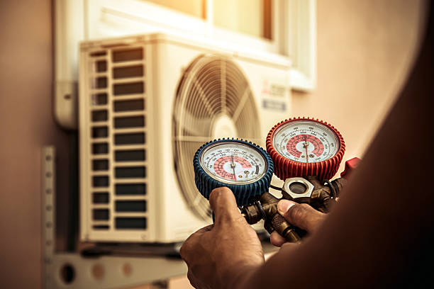 Professional Air Conditioning Service technician working in Avella, PA